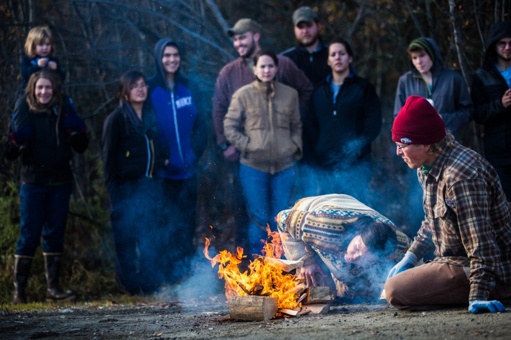 School of Natural Resources and Agricultural Sciences alumni Nina Schwinghammer and Adrian Baer fan the flames at the fire-building competition during the 16th annual Farthest North Forest Sports Festival at Ballaine Lake Oct. 5.