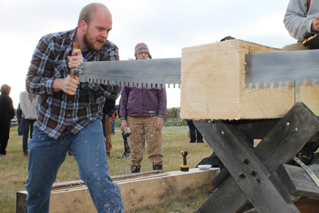 Photo courtesy of SNRAS. James Ward competes in the crosscut sawing competition in the 2011 Forest Sports Festival.