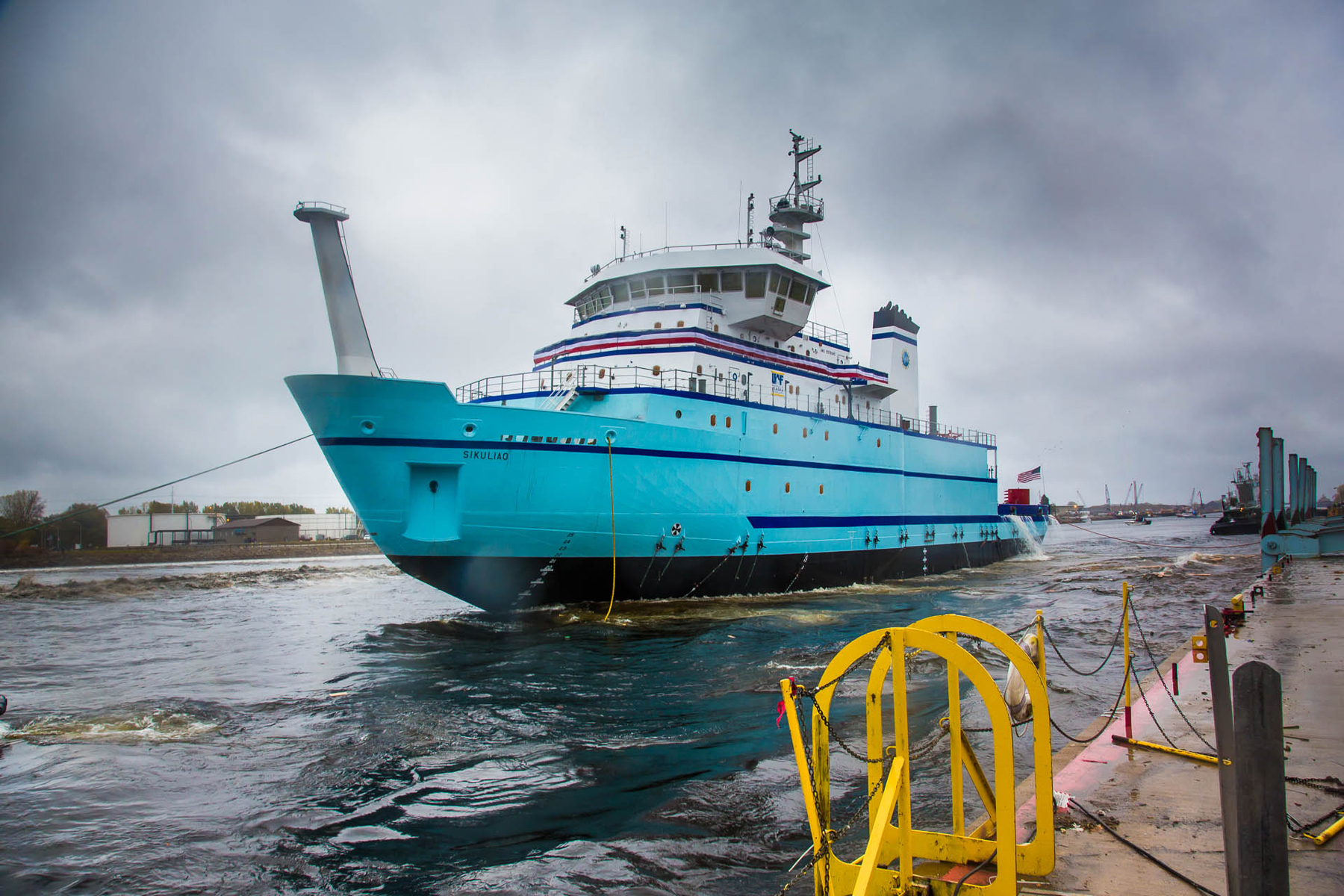 UAF photo by Todd Paris. The 261-foot Sikuliaq rests in the water moments after its launch from a shipyard in Marinette, Wis.