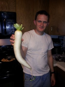 Photos courtesy of Frozen Fireweed Farm. Nathan O'Dell-Andersen holds a radish grown at Frozen Fireweed Farm.