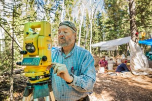 Photos by © Loren Holmes / AlaskaDispatch.com. Chuck Holmes calibrates a total station, used to precisely map artifacts at Swan Point, one of the earliest human settlements ever discovered in Alaska. It contains evidence of humans hunting Mammoths.