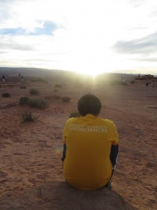Photo courtesy of CNSM. A student takes time to reflect as his peers explore the southwestern landscape.