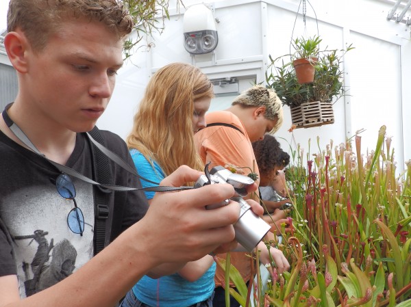 Tanana District 4-H'er Dakota Wilcher and other youth tour a greenhouse during an exchange to New Jersey this past summer.
