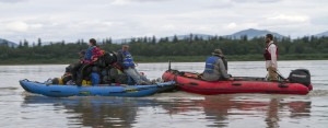 Photo by Kevin May. The dinobarge in action: heading down the Yukon River.