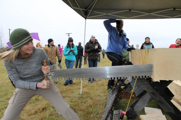 Amy Rath competes in the crosscut sawing event at the Farthest North Forest Sports Festival in 2012.