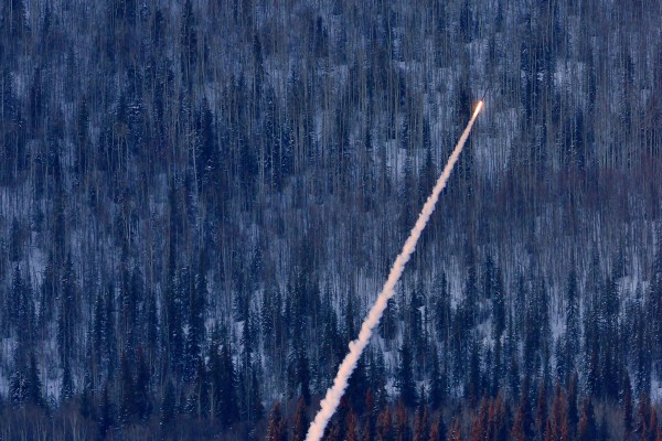  Photo by Mark Conde. A small test rocket flies from Poker Flat Research Range on Feb. 9, 2014.