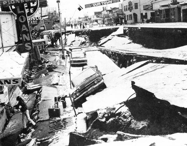 The Great Alaska Earthquake occurred on March 27, 1964. It rang in at an astounding magnitude 9.2. The quake and ensuing tsunami took 128 lives and caused about $311 million in property loss.. Anchorage, northwest of the epicenter, sustained the most severe damage to property. About 30 blocks of dwellings and commercial buildings were damaged or destroyed in the downtown area as portions of it collapsed more than 11 feet during the quake. This photo shows the damage in the downtown area.. More information about the Great Alaska Earthquake is available at http://earthquake.usgs.gov/.../states/events/1964_03_28.php.. UPI photo.