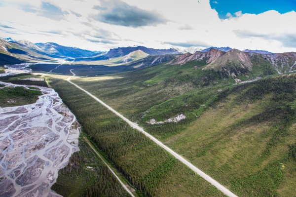UAF photo by Todd Paris.  This photo shows several frozen debris lobes which are moving at various speeds down the hillsides along the Dietrich River valley in the southern Brooks Range, posing a potential threat to the Dalton Highway and trans-Alaska pipeline.
