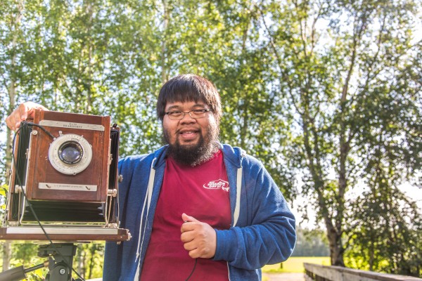 JR Ancheta, majoring in journalism and French, finds time on a summer morning to pursue his passion for photography at Creamer's Field Migratory Waterfowl Refuge in Fairbanks.