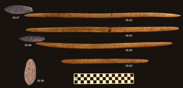 UAF photo courtesy of Ben Potter .  Stone projectile points and associated decorated antler foreshafts from the burial pit at the Upward Sun River site.