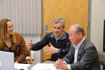 Photo by Yuri Bult-Ito. IARC researcher Vladimir Alexeev (middle) explains some differences between the Arctic and Antarctica.