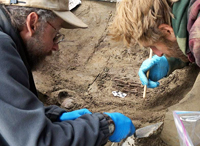 University of Alaska Fairbanks professors Ben Potter and Josh Reuther excavate the burial pit at the Upward Sun River site.