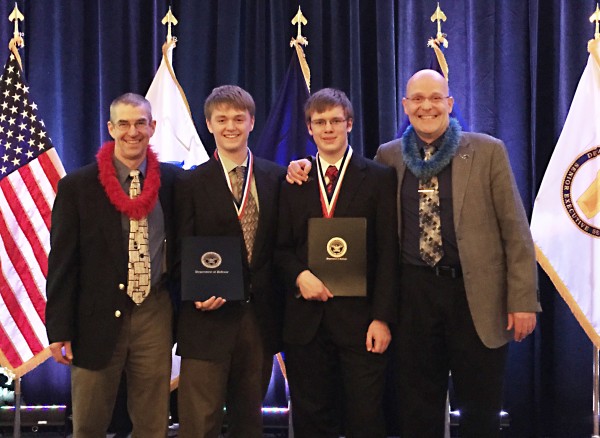 West Valley High School science teacher Gregory Kahoe, Petersburg High School student Ian Fleming, West Valley student Michael Kaden-Hoffmann and Alaska Statewide High School Science Symposium director Abel Bult-Ito, left to right, pose after Fleming and Kaden-Hoffmann won awards at the 53rd National Junior Science and Humanities Symposium in Hunt Valley, Maryland. Photo courtesy of Abel Bult-Ito.