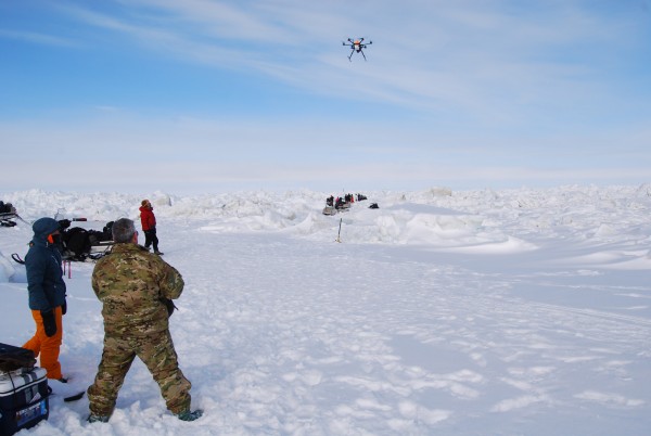 UAF photo by Dyre Oliver Dammann. Pilot John Rogers flies a Ptarmigan unmanned aerial vehicle north of Barrow in April 2015.