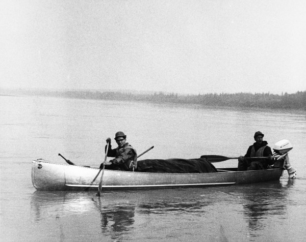 Photo courtesy Elmer E. Rasmuson Library, acc. UAF-1986-0168-00001..  Paul McCarthy, left, and Ted Ryberg canoe on the Yukon River in 1966 during a search of materials for the university archives.