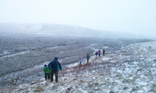 Photo by SJ Shu..  IARC summer school participants face snowy weather during their fieldwork.