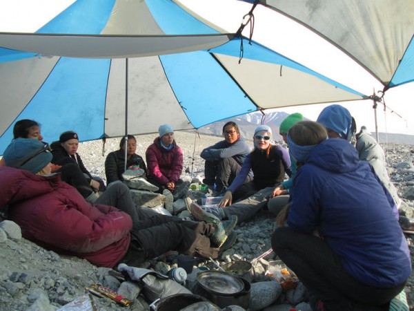 Kjerstan Matson (girl in blue-rimmed sunglasses) joins in one of many group discussions that helped the girls build trust in each other so that they could work as a team in conducting their field studies of the glacier. Photos courtesy of Girls on Ice.