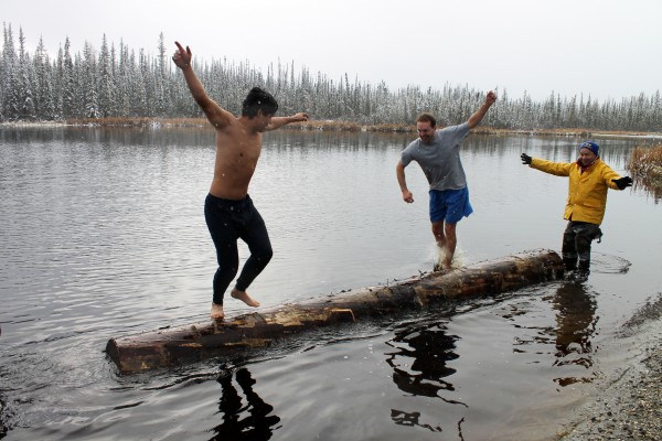 Competitors try birling at Ballaine Lake during the 2014 Forest Sports Festival.