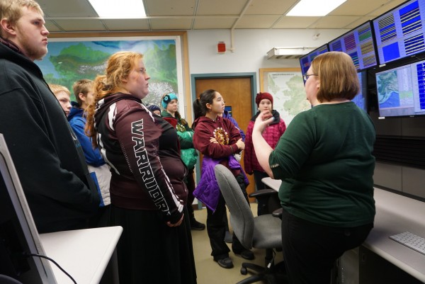 Photo courtesy of EarthScope National Office. Nikolaevsk students learn about real-time earthquake data while visiting the Alaska Earthquake Center.