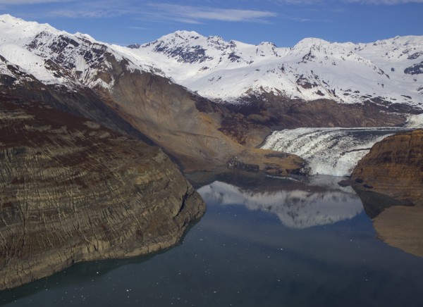 Photo courtesy Chris Larsen. A gray, snowless scar at center left in this photograph shows where a mountainside slid into Icy Bay's Taan Fiord in October.