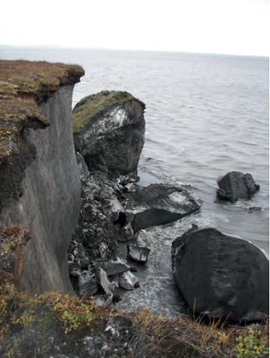 Photo by Igor Semiletov. Erosion can eat as much as 100 feet of coastline in two weeks at the northern cape of Muostakh Island on Siberia's coast.