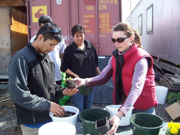 Photo courtesy Heidi Rader.  Tribes Extension Educator Heidi Rader talks about transplanting flowers and vegetables during a workshop in Arctic Village.