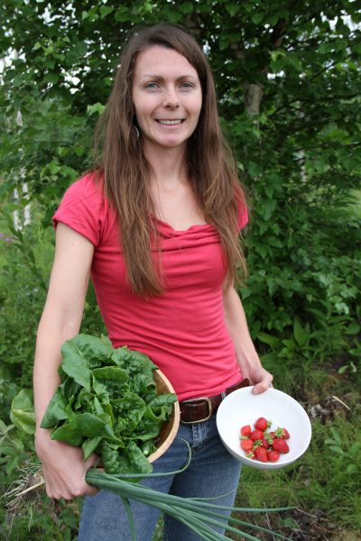 Photo courtesy of Heidi Rader.  Heidi Rader shows some of the produce from her garden. She teaches workshops on seed starting, transplanting and gardening in the Tanana Chiefs Conference region.