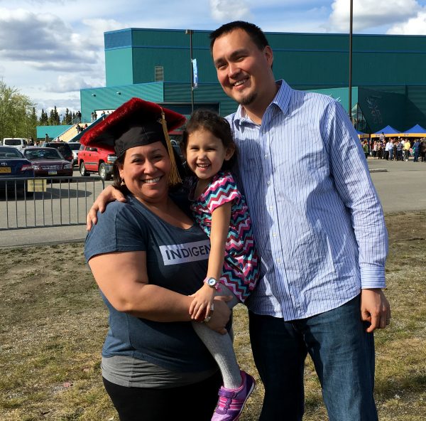 Pearl Brower photo.  Pearl Brower and her husband, Donald Jesse Darling Jr., pose with their daughter Isla after Pearl received her doctorate degree in indigenous studies from the University of Alaska Fairbanks in May.