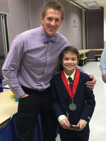 Photo courtesy of School of Management. Wylie Rogers and cub division second place winner Corbin Becker pose at the 2015 Alaska Innovation Competition.