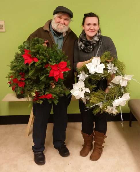 Photo by Nicole Dunham. Bill and Cassandra Sanborn display the wreaths they created at OneTree's wreath-making event in 2015.
