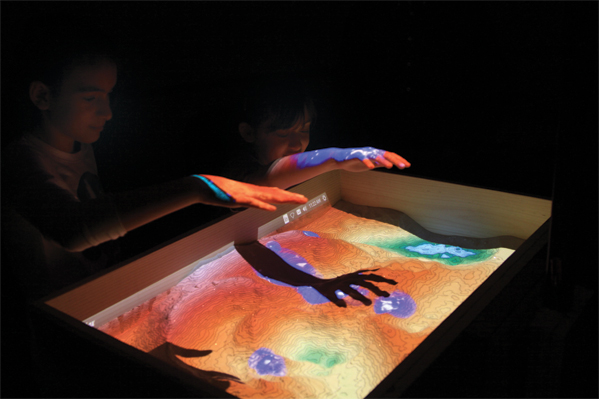 Photo by Meghan Murphy Many partners across campus make Science Potpourri possible with fun activities like this interactive topographic map in a sandbox.