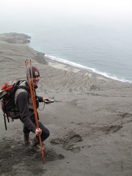 Photo by Ned Rozell. Biologist Jeff Williams explores Kasatochi Island one year after its 2008 eruption.