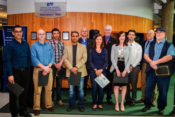 UAF photo.  Winners of the 2016 Invent Alaska awards gather with Vice Chancellor of Research Larry Hinzman, fifth from right, and Mark Billingsley, Office of Intellectual Property and Commercialization contracts director, third from right. The winners, from left, include Rajive Ganguli, Rob Rember, Simon Filhol, Tathagata Ghosh, Rich Collins, Heidi Rader, Mindy Courter, Robert Coker and James Long.