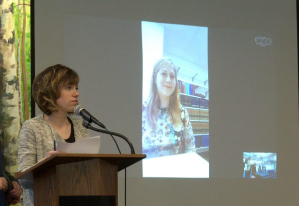 Photo by Victoria Smith.  UAF Student Support Services Director Ginny Redmond, at the microphone, presents the 2017 TRiO Acheiver Award to Lacey Brewster, on the screen, via Skype.