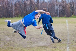 Daylen Evanger goes airborne in his attempt to sack the opposing quarterback during a UAF intramurals flag football game in the field by the SRC. 
