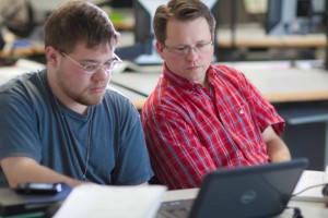 Assistant professor Thane Magelky, right, works with freshman James Griffin in his drafting technology class in the CTC center downtown.