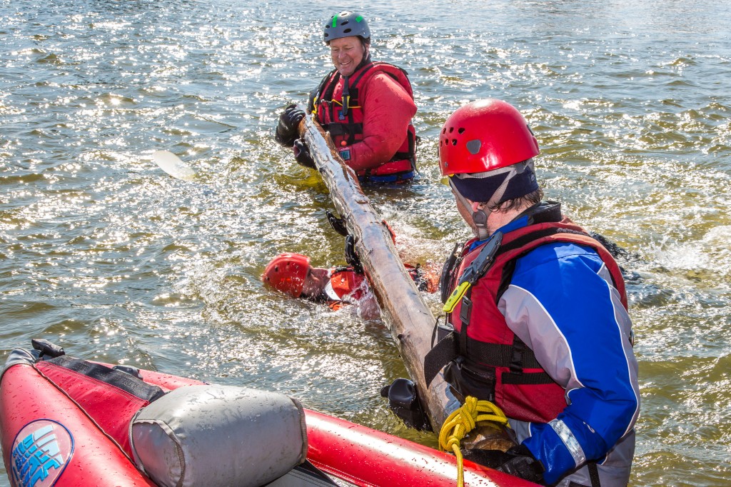 Dick Rice with Rescue Alaska, top, trains staff members and graduate students with the Water and Environmental Research Center (WERC) and the Institute of Northern Engineering (INE) in cold water, fast current rescue and safety techniques in the Chena River.