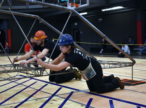Photo courtesy of Taylor Tharp. UAF Steel Bridge Team members Larry Hiles, left, and Juliana Rivera help construct the team's winning entry at the regional competition in Lacey, Washington.