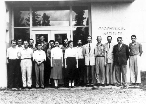 Geophysical Institute employees gather in 1958 in front of the Chapman Building, which originally housed the institute. The then-director, C.T. Elvey, is third from the right.